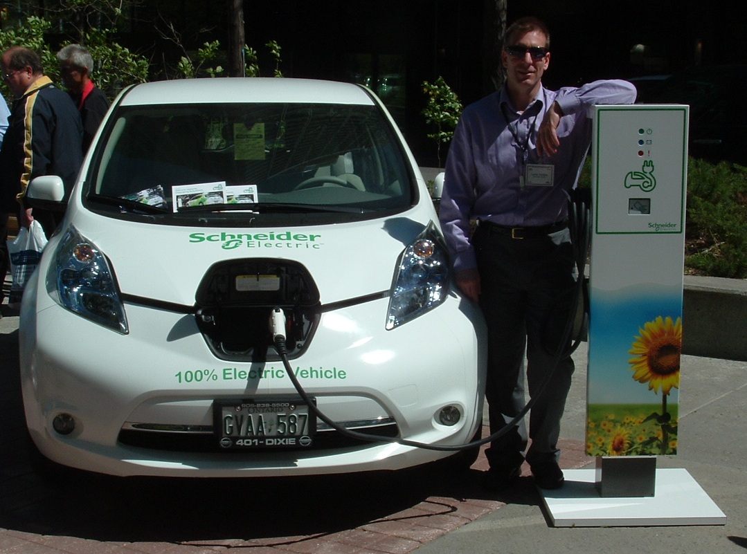 Schneider's Nissan Leaf with charging station
